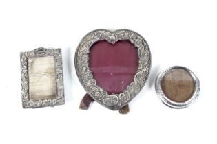 Three Victorian and later silver-mounted easel-back photograph frames.