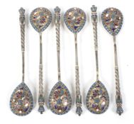 A set of six early 20th century Russian parcel gilt and cloisonne enamelled coffee spoons.