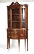 Maple & Co - a glazed top bow fronted inlaid cabinet.