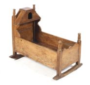 An 18th century and later American peg jointed crib/cradle bassinet on bows. 77cm high x 91.