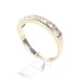 A vintage 9ct gold and diamond seven stone half-eternity ring. The round brilliant stones approx. 0.