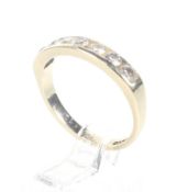 A vintage 9ct gold and diamond seven stone half-eternity ring. The round brilliant stones approx. 0.