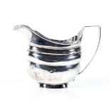 A George III English provincial silver oblong milk jug.