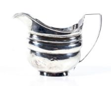 A George III English provincial silver oblong milk jug.
