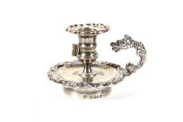 A William IV silver small shaped-round taper stick from an ink stand.