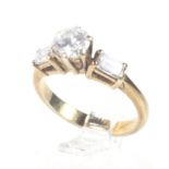 A vintage gold and diamond solitaire ring with diamond shoulders.