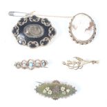 Five Victorian and later brooches.