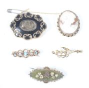 Five Victorian and later brooches.