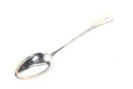 A William IV silver old English pattern serving spoon.