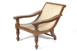A mid-20th century Colonial tea planters chair with hardwood hinged arms and caned seat, 84cm, high,
