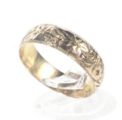 A mid-Victorian 9ct gold floral chased wedding band.