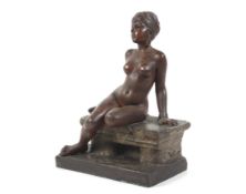 E Villanis, a patented spelter figure of a North African nude tethered to a stone.