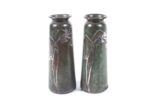 Arts and Crafts, A pair of patinted bronze and silver inlay vases. Marked under 'Pat.Apd.For.
