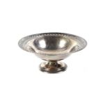 An Edwardian silver round pedestal sweet dish.