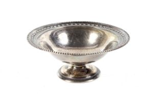 An Edwardian silver round pedestal sweet dish.