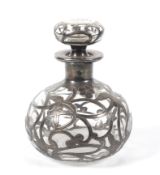 An Art Nouveau mounted clear glass scent bottle.