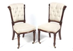 A pair of mid to late Victorian button back mahogany over stuffed 'knocker' chairs. 91.