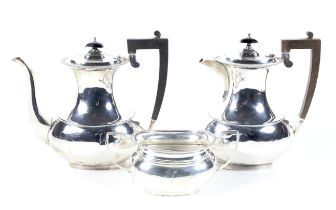 A vintage silver oval three piece coffee service.