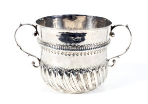 A William III silver porringer.