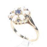 A modern 14ct gold, opal and sapphire cluster ring.
