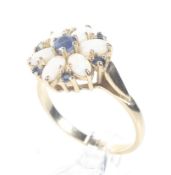 A modern 14ct gold, opal and sapphire cluster ring.