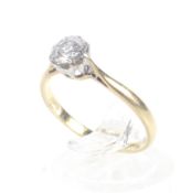 A vintage gold and diamond solitaire ring, circa 1960. The round brilliant approx. 0.