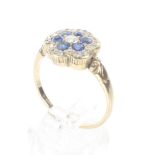 An early 20th century gold, sapphire and diamond hexafoil ring.