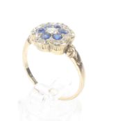 An early 20th century gold, sapphire and diamond hexafoil ring.