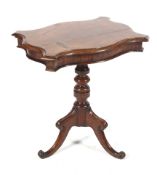 A 19th century oak serpentine sided tripod table. With turned central column, H53.5cm x W48.