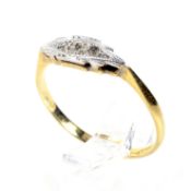 An early 20th century gold and small diamond three stone ring.