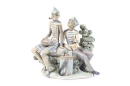 Lladro: a figure group depicting seated male and female in military orchestral uniforms. 29.