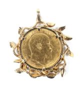A sovereign 1903, mounted in a vintage abstract leaf and branch pendant. Apparently unmarked, 12.