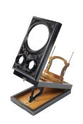 A Victorian ebonised stereoscopic viewer.