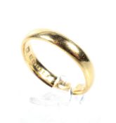 An early 20th century 22ct gold D-section wedding band. Hallmarks for Birmingham 1922, 3.