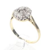 A mid-20th century 18ct gold and diamond cluster ring.