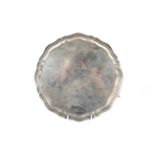 A silver shaped round salver.