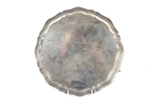 A silver shaped round salver.