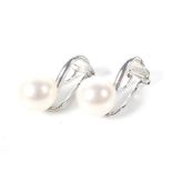 A pair of 18ct white gold and cultured-pearl clip earrings. Each set with an 8.