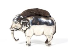 A silver 'elephant' pin cushion.