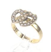 A late Victorian 18ct gold and half-pearl entwined twin-hearts ring.