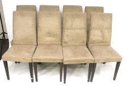 A set of eight contemporary suede upholstered dining chairs.
