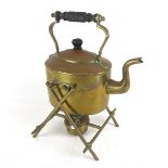 A brass kettle and stand.