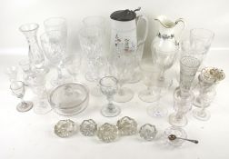 An assortment of drinking glasses and three pieces of ceramics.