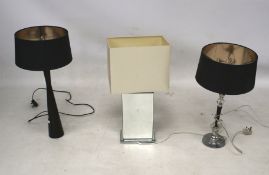 Three contemporary table lamps and shades.