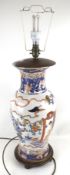 A 20th century Chinese vase converted into a table lamp.