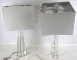 A pair of contemporary clear glass table lamp bases. With square shades.