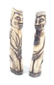 A pair of carved bone tribal figures. Modelled as men smoking pipes, H13.