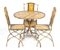 A bamboo effect round cafe table and three folding chairs.