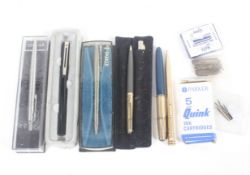 A collection of pens and stationary.