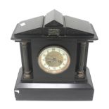 A 20th century black slate striking mantle clock.